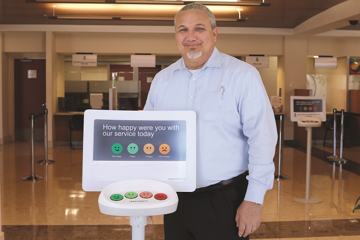 DG with HappyOrNot terminal.jpg